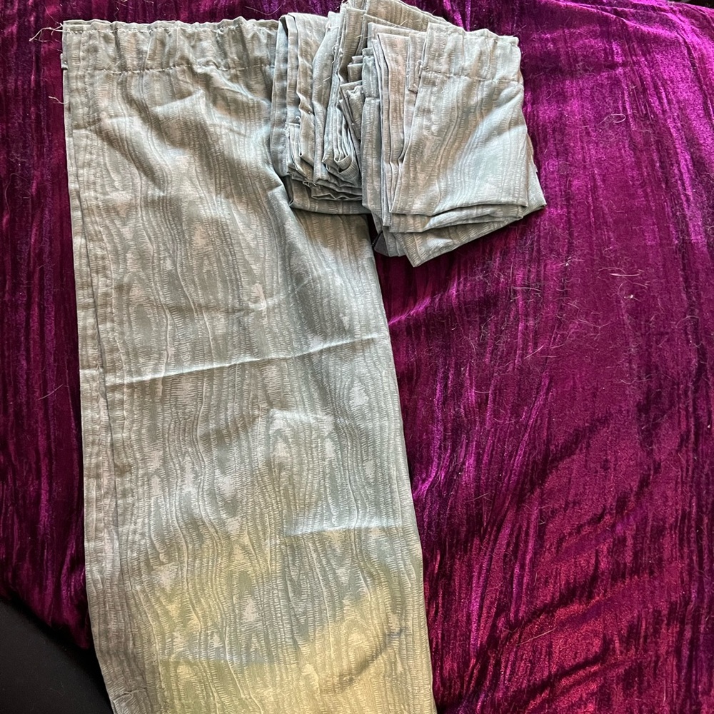 Eight semi sheer green and white rod pocket curtains